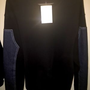 Givenchy navy sweater with denim accents.